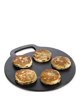 Product photograph of Kitchencraft Round Cast Iron Baking Stone Cooking Griddle from very.co.uk
