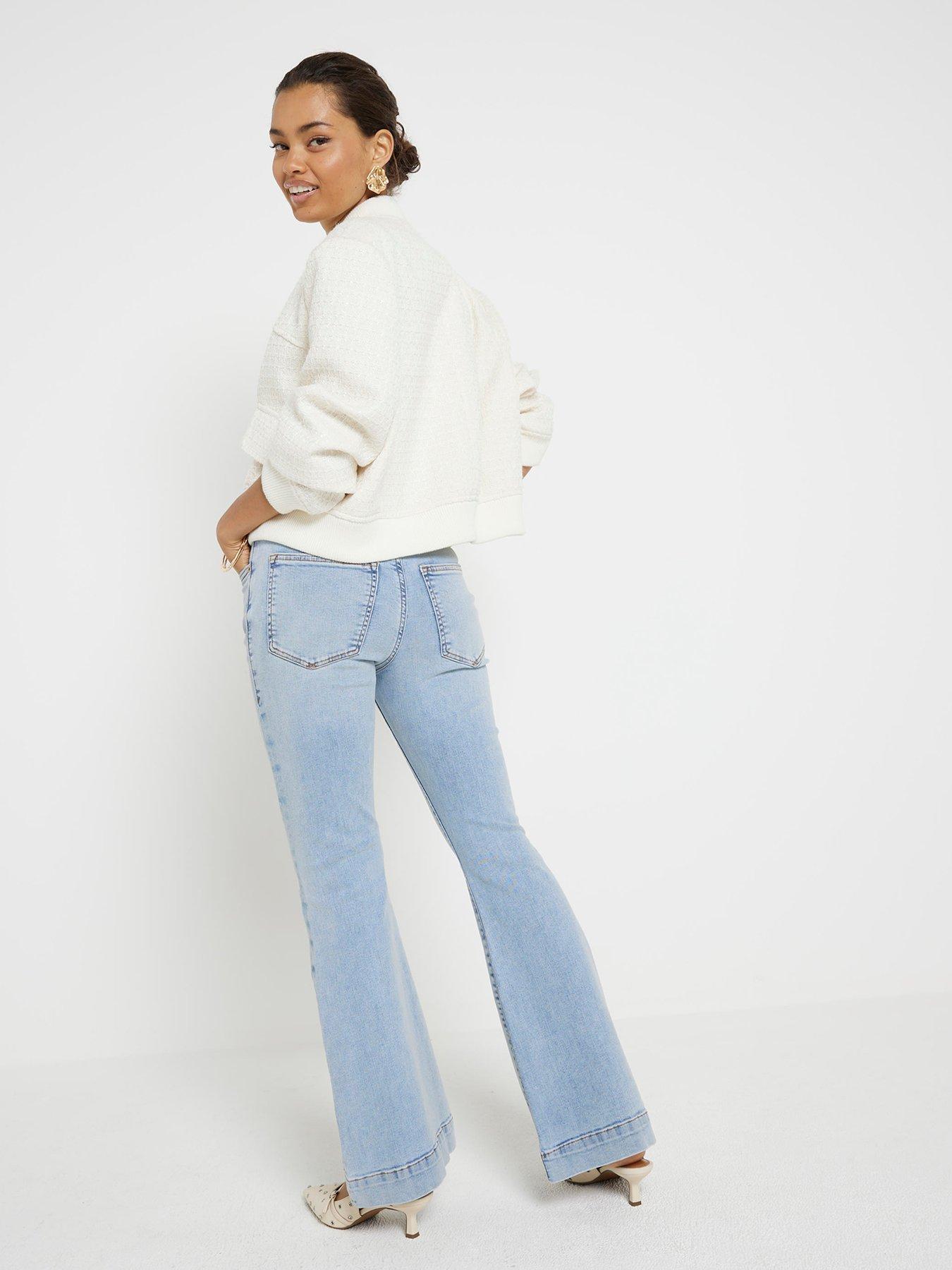 Image 2 of 5 of River Island Petite High Waisted Flared Jeans - Light Blue