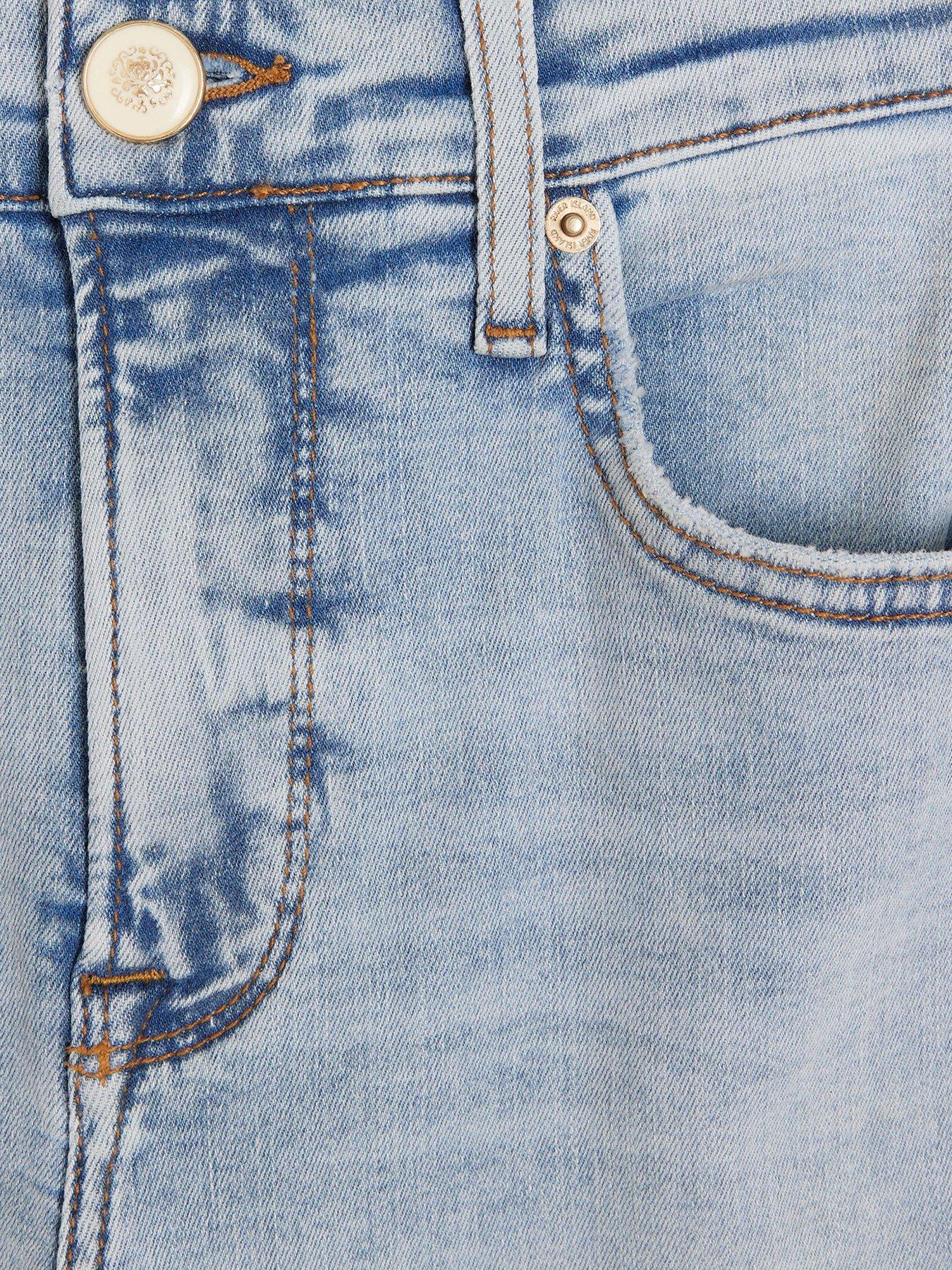 Image 4 of 5 of River Island Petite High Waisted Flared Jeans - Light Blue
