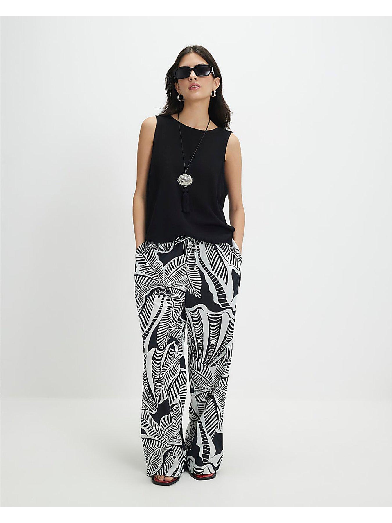 Image 1 of 1 of River Island Petite Linen Blend Printed Trousers