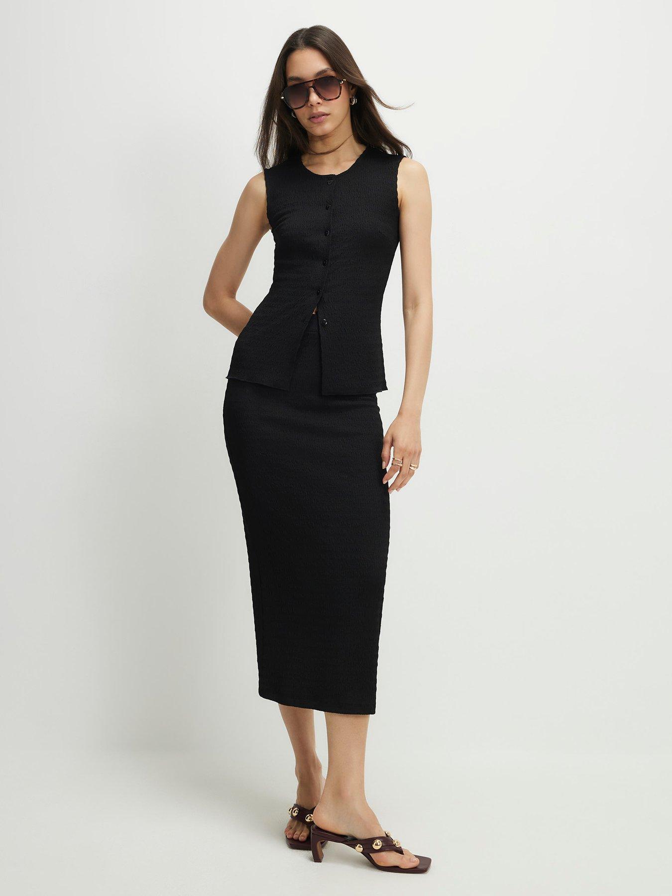 Image 1 of 1 of River Island Textured Midi Skirt - Black
