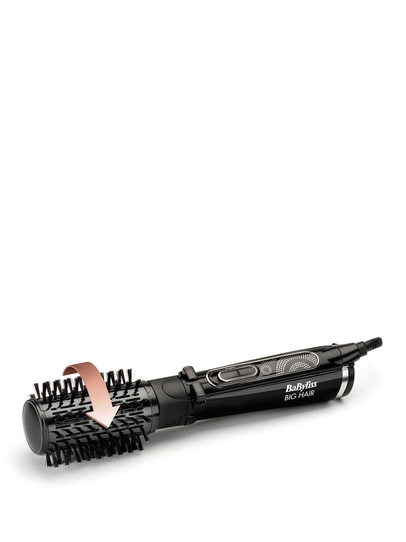 Rotating hair outlet styling brush