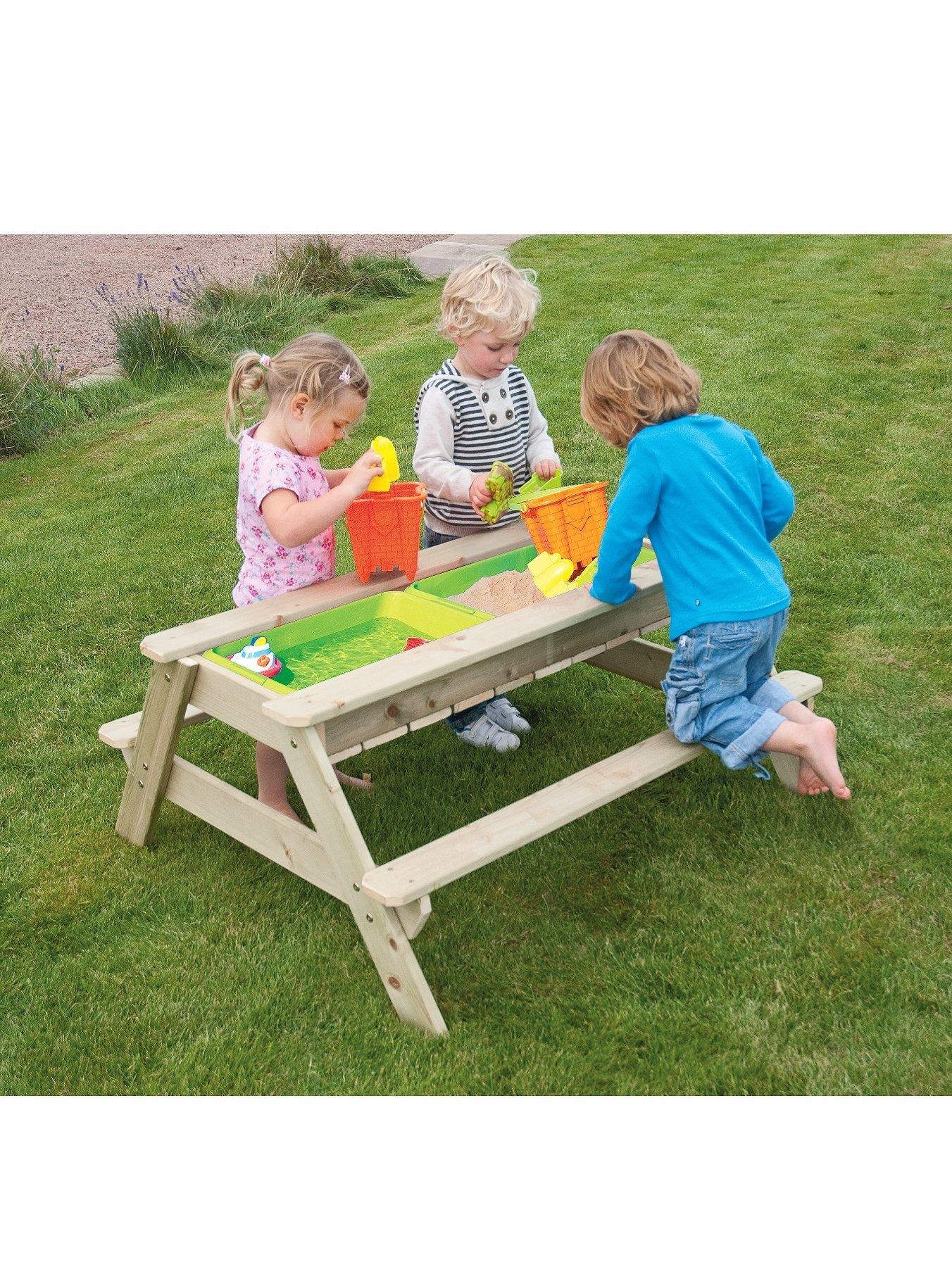 wooden picnic table sandpit