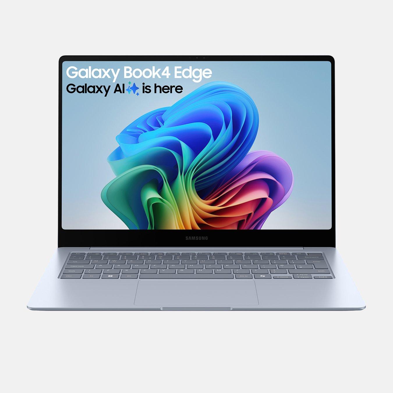 A Samsung Galaxy Book4 Edge Copilot+ PC laptop displaying a colourful purple and blue digital design on its screen. The top of the screen reads 'Galaxy Book4 Edge' and 'Galaxy AI is here.' The laptop is positioned on a white surface.