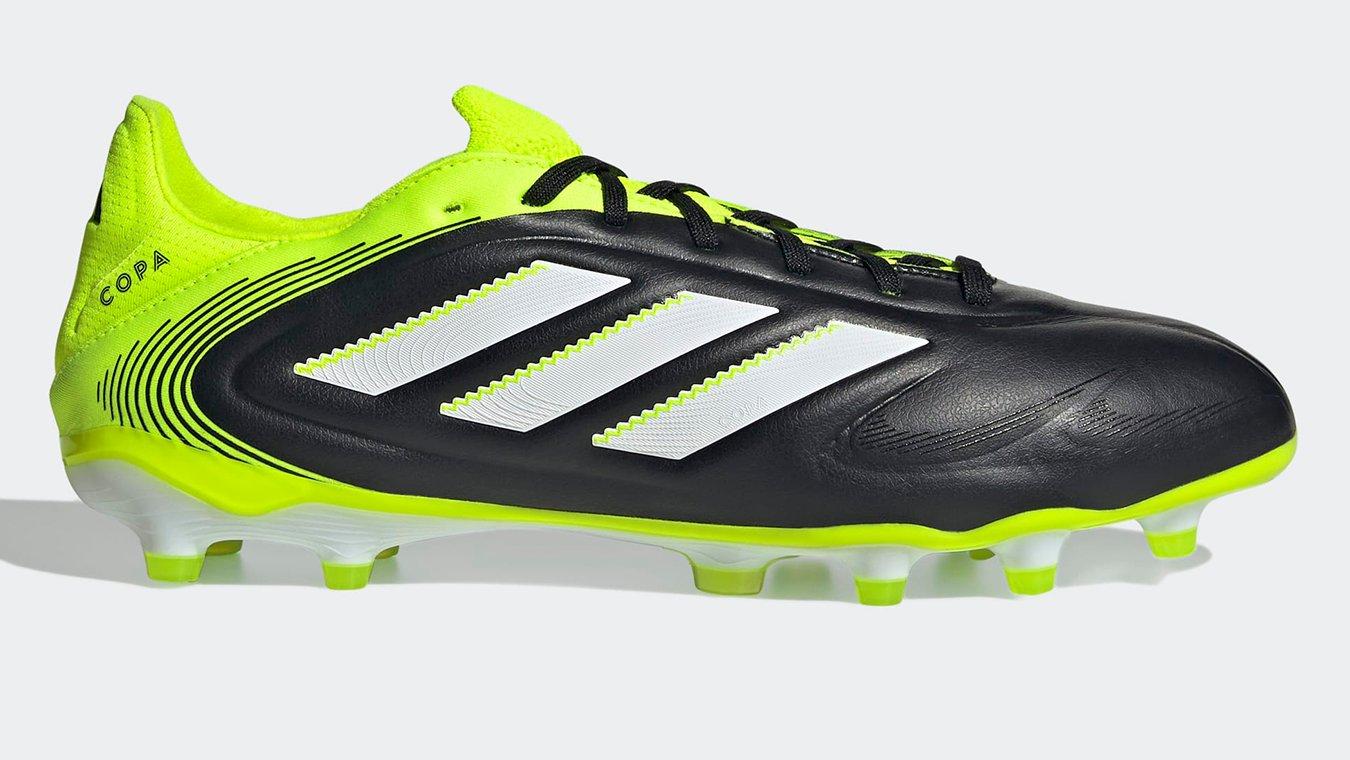 Side view of a black and neon yellow pair of adidas Copa Football Boots. Perfect football boots for defenders.