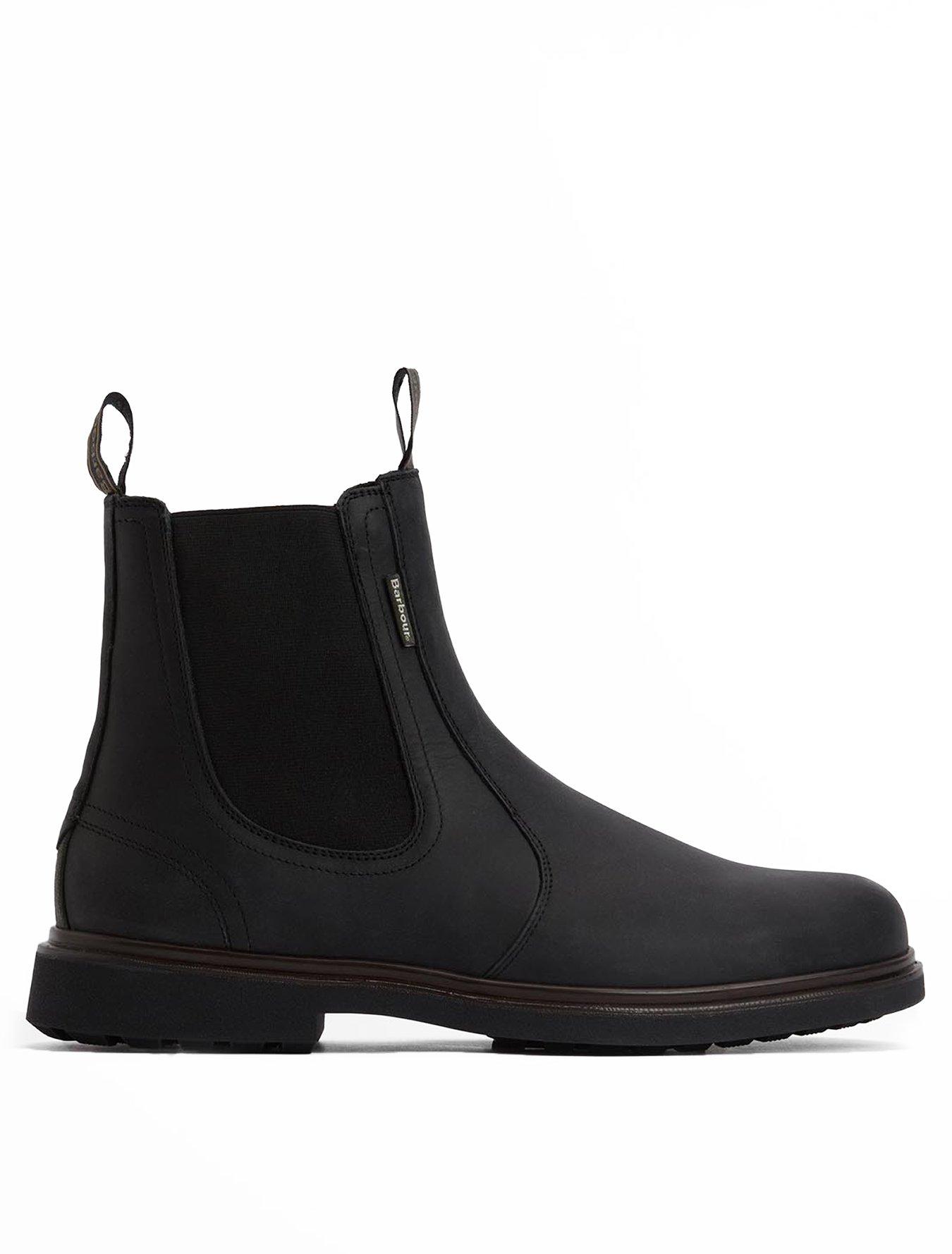 Side view of a mans black formal chelsea boot on a white background