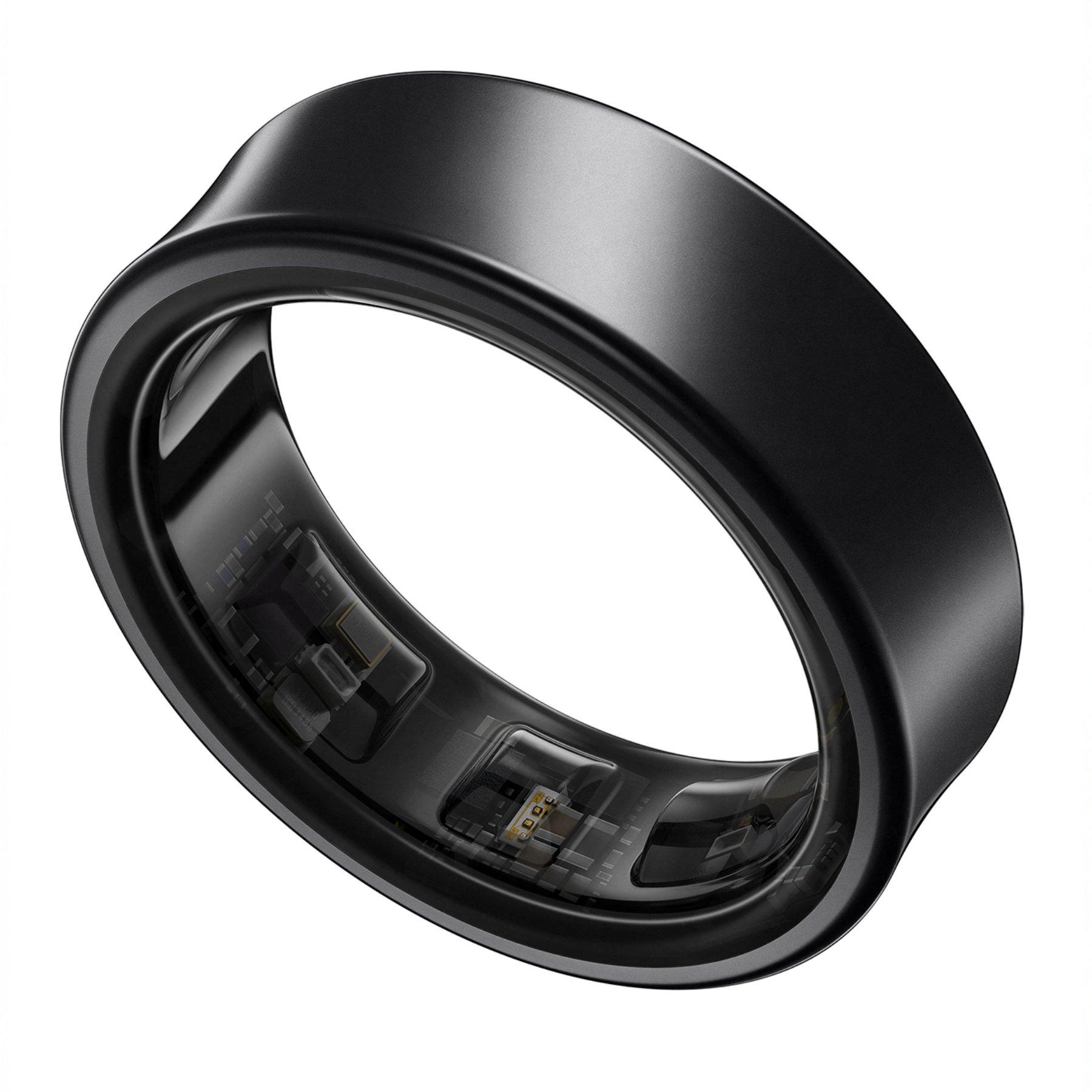 Image of the Samsung Galaxy Ring against a white background. The ring is black and shows the technology on the inside.
