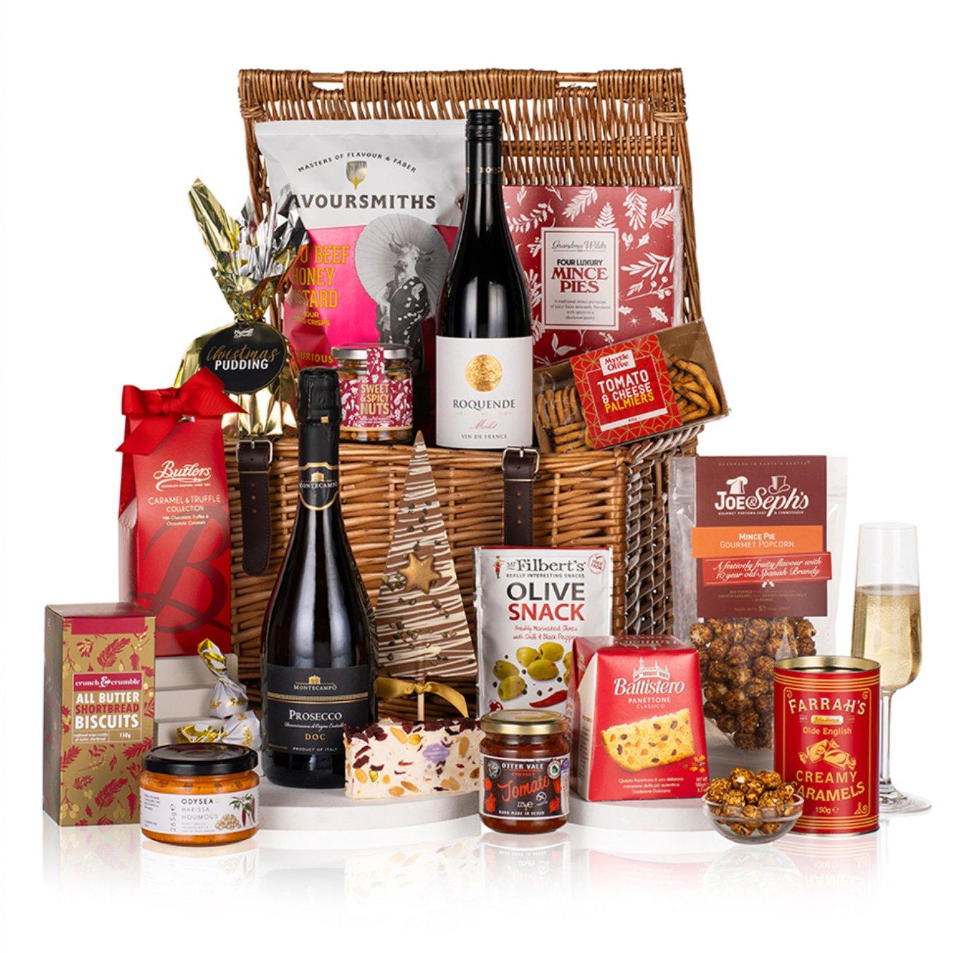 The Virginia Hayward Taste of Christmas Basket displayed. A hamper with a range of foods like wine, crackets, prosecco and more. 