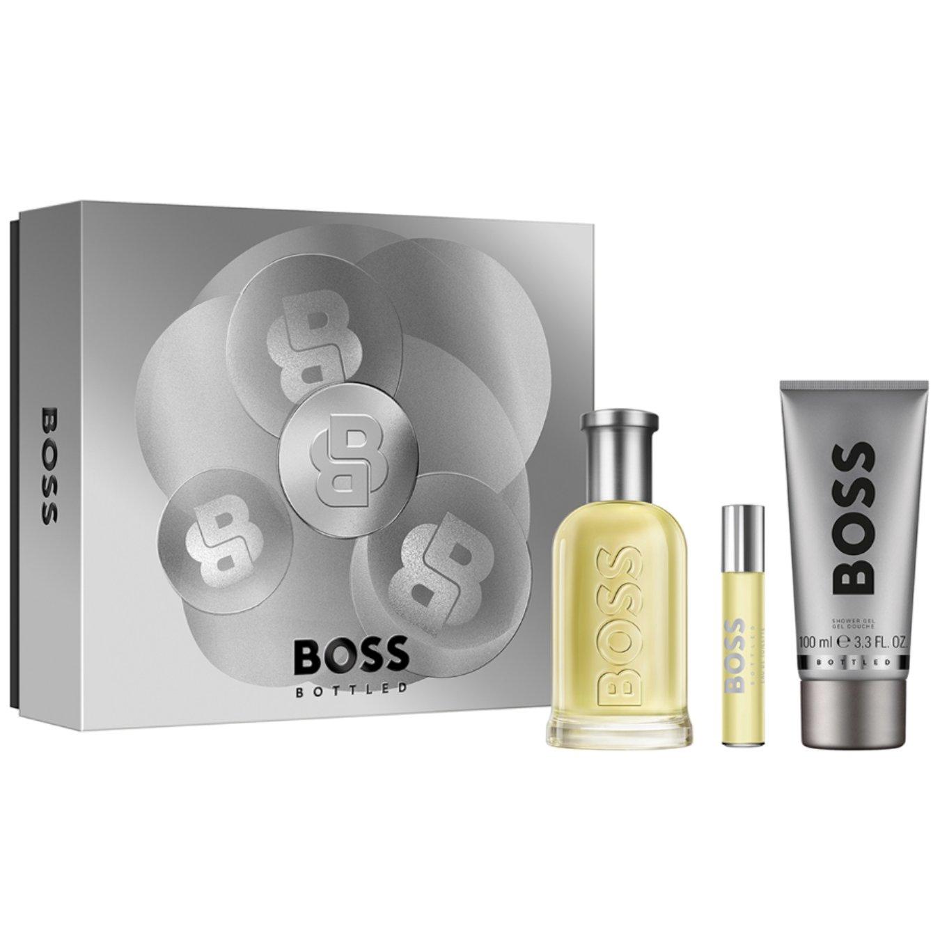 The Hugo Boss BOSS Bottled Eau de Toilette and Shower Gel for Men Trio Gift Set. A regular size bottle of aftershave and a mini travel size next to an accompanying body wash.