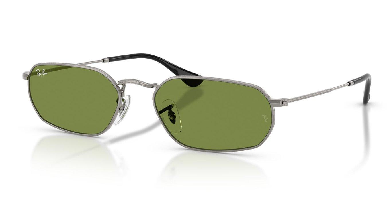 A pair of silver metal framed Rayban sunglasses with green lenses