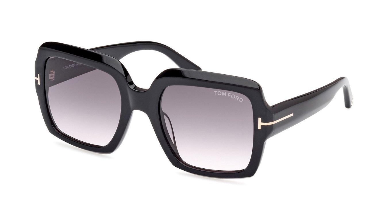 A pair of oversized Tom Ford sunglasses with grey lenses and a black frame