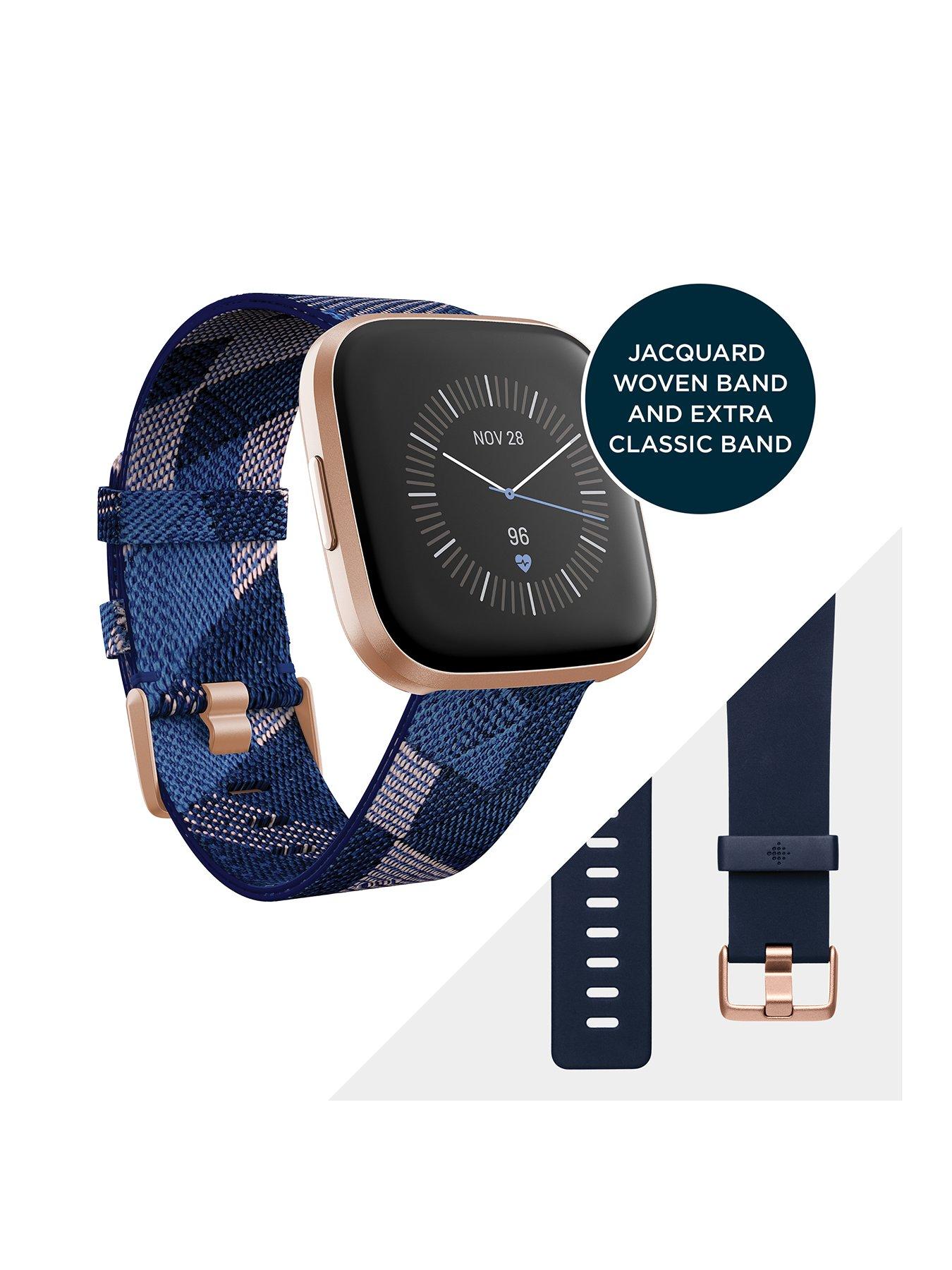 navy and pink fitbit versa 2