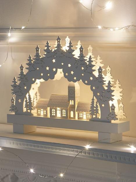 white-wood-lit-candle-bridge-scene-christmas-decoration