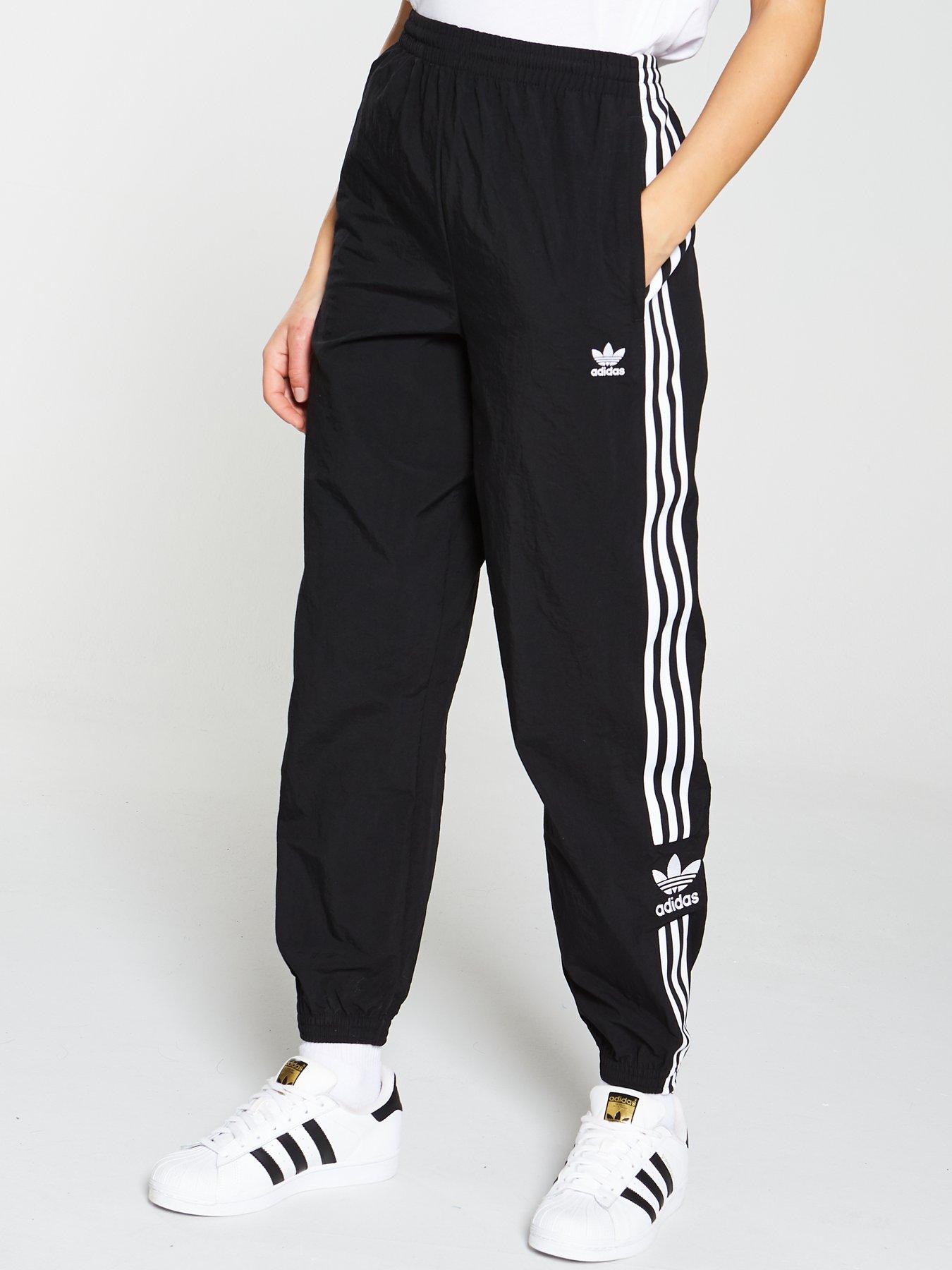 adidas originals adicolor locked up logo track pants in black