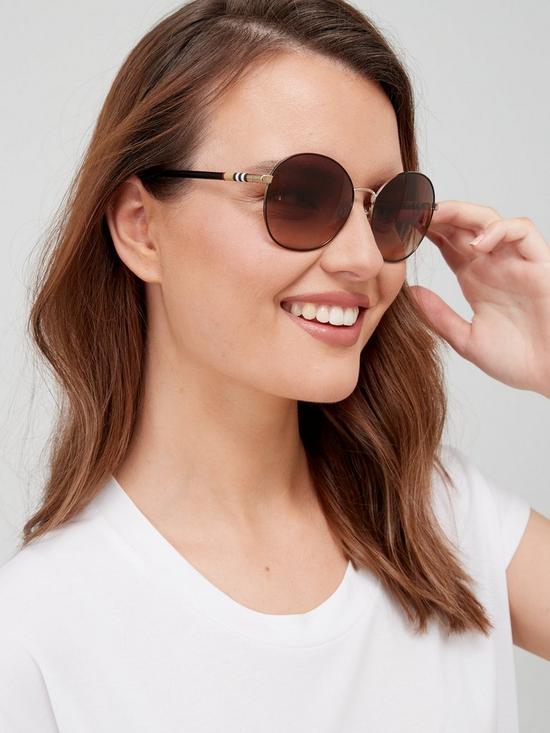 front image of burberry-round-sunglasses-light-gold
