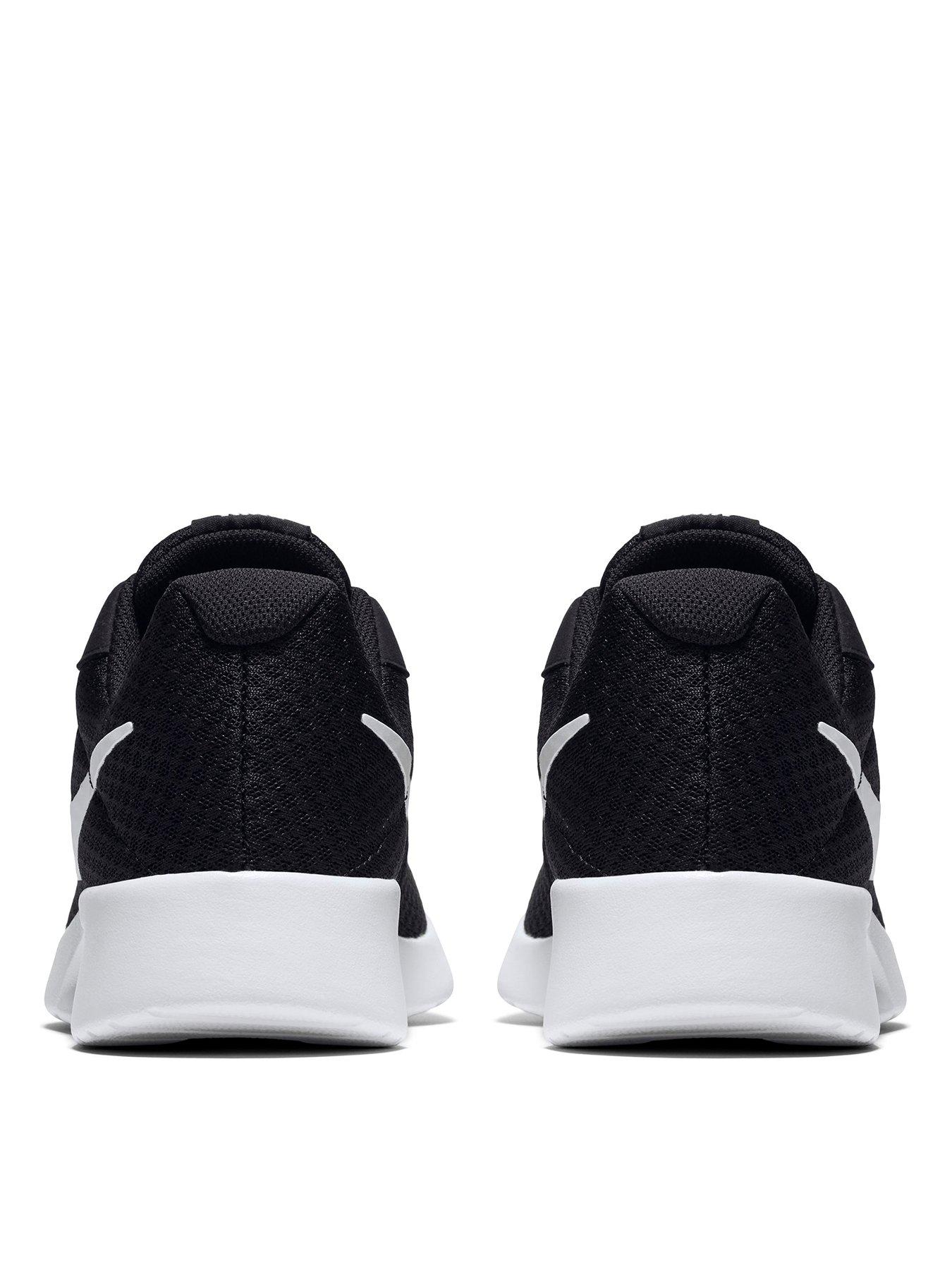 white and black nike tanjun