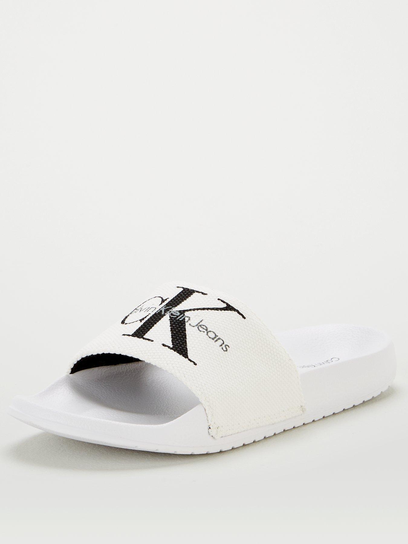 white calvin klein sliders