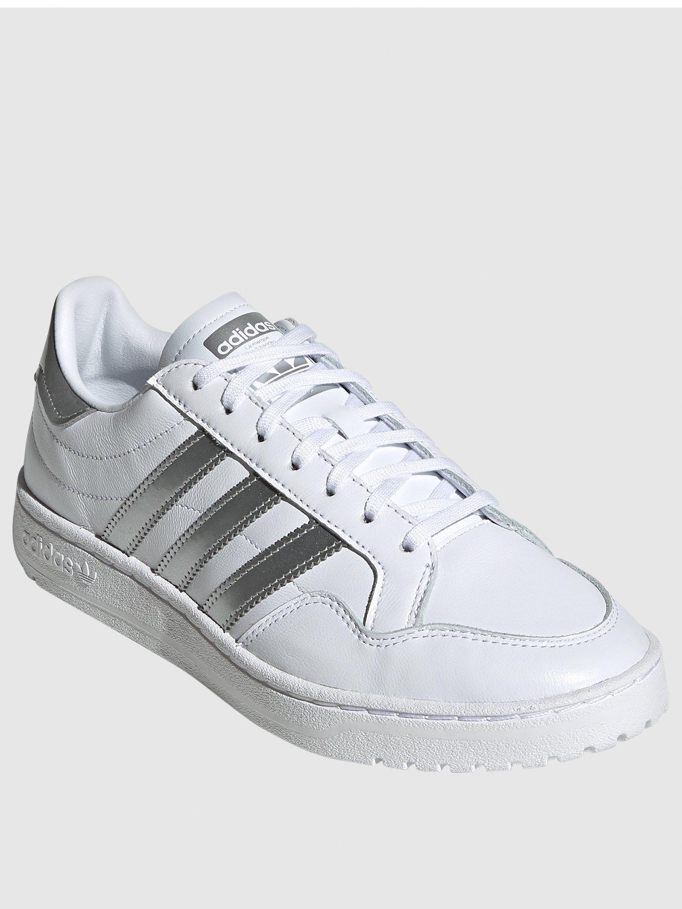 white and silver adidas trainers