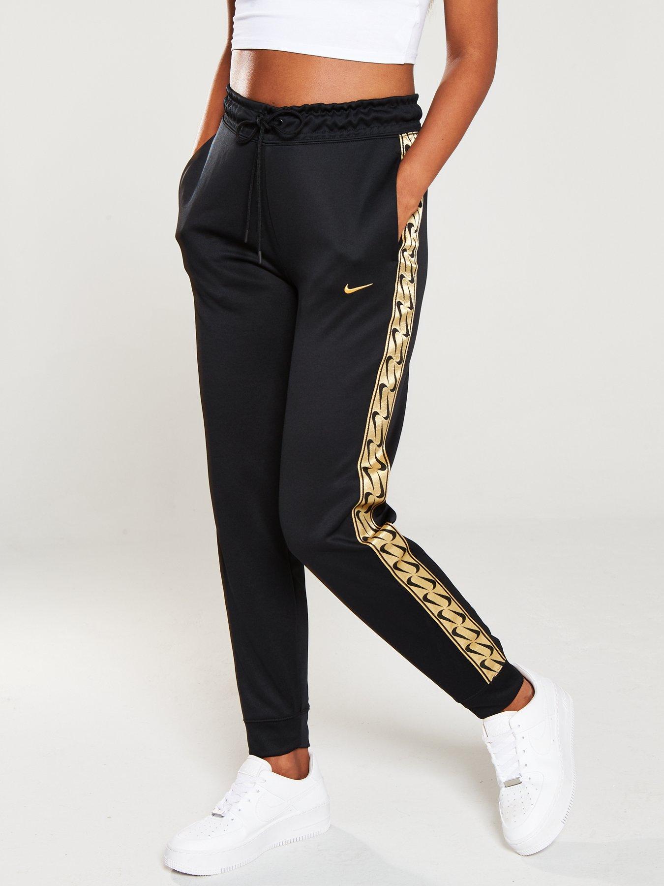 nike black and gold track pants