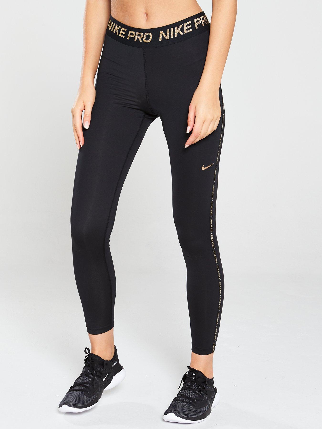 gold and black nike tights