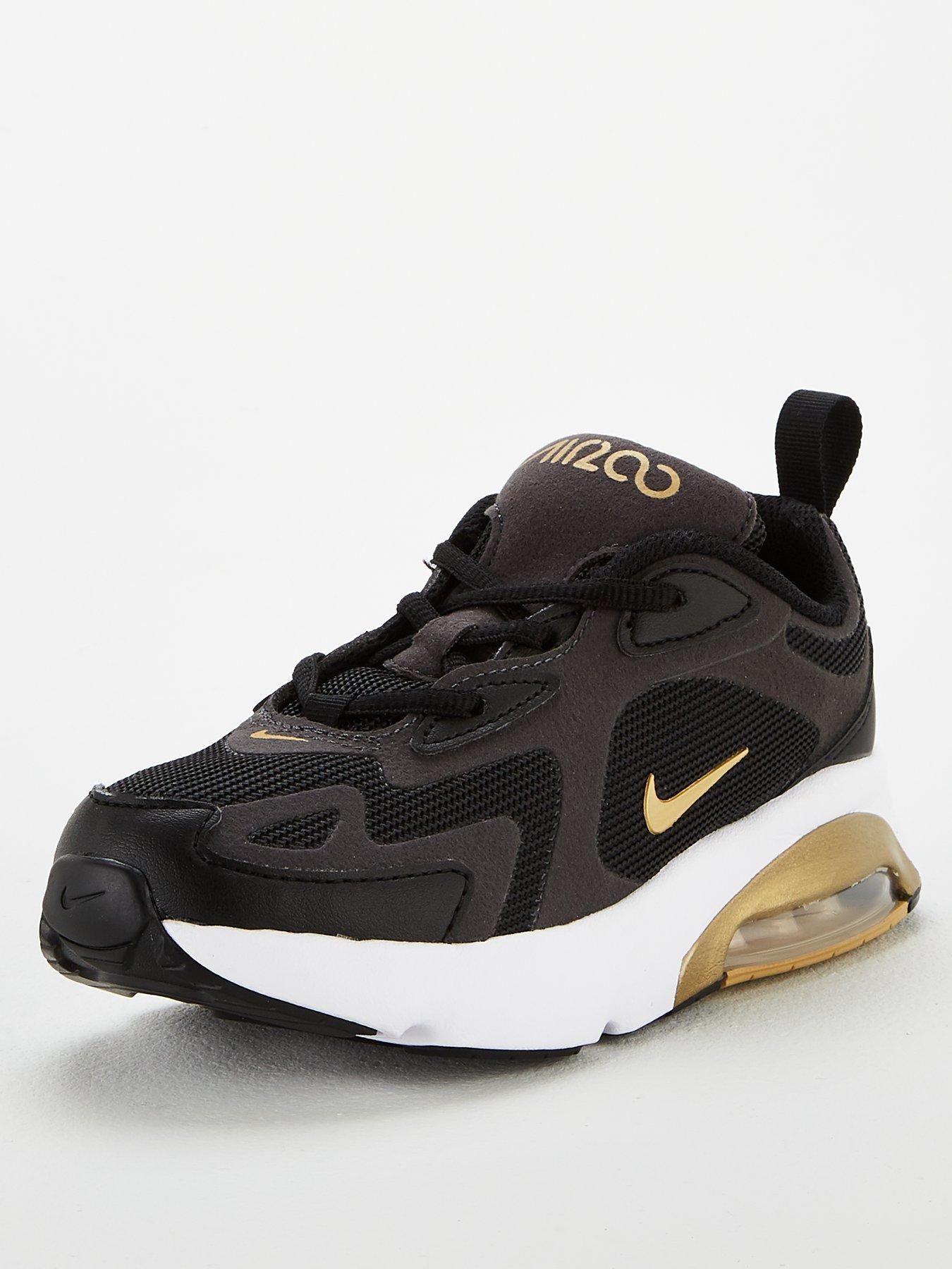 nike gold and black trainers