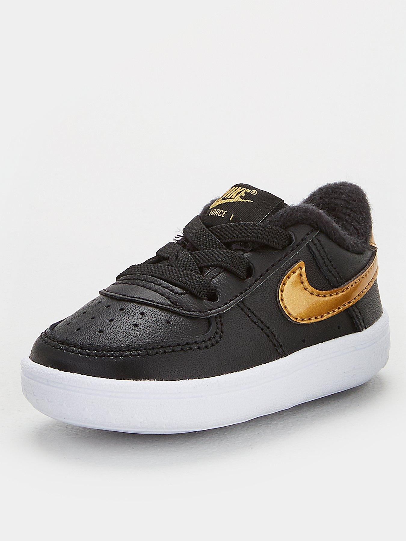black and gold nike trainers