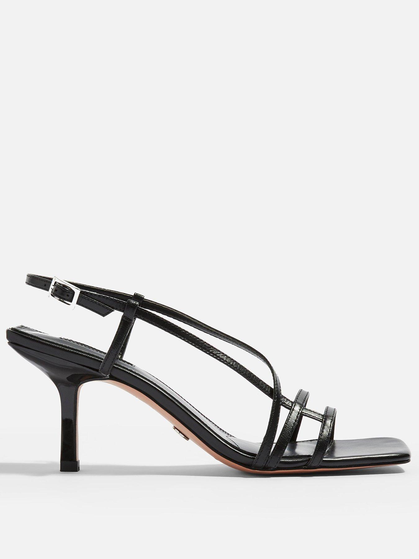 very strappy heels