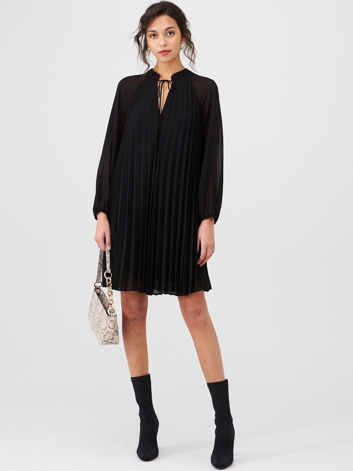 black pleated swing dress