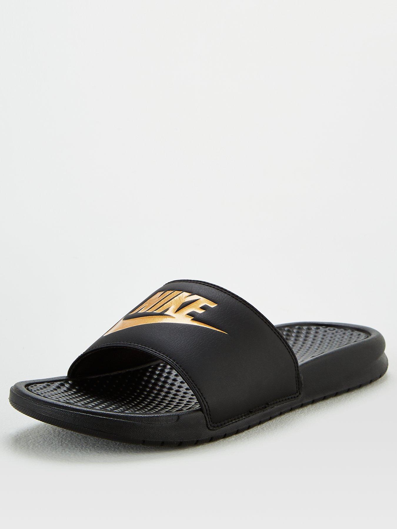 nike gold and black slides