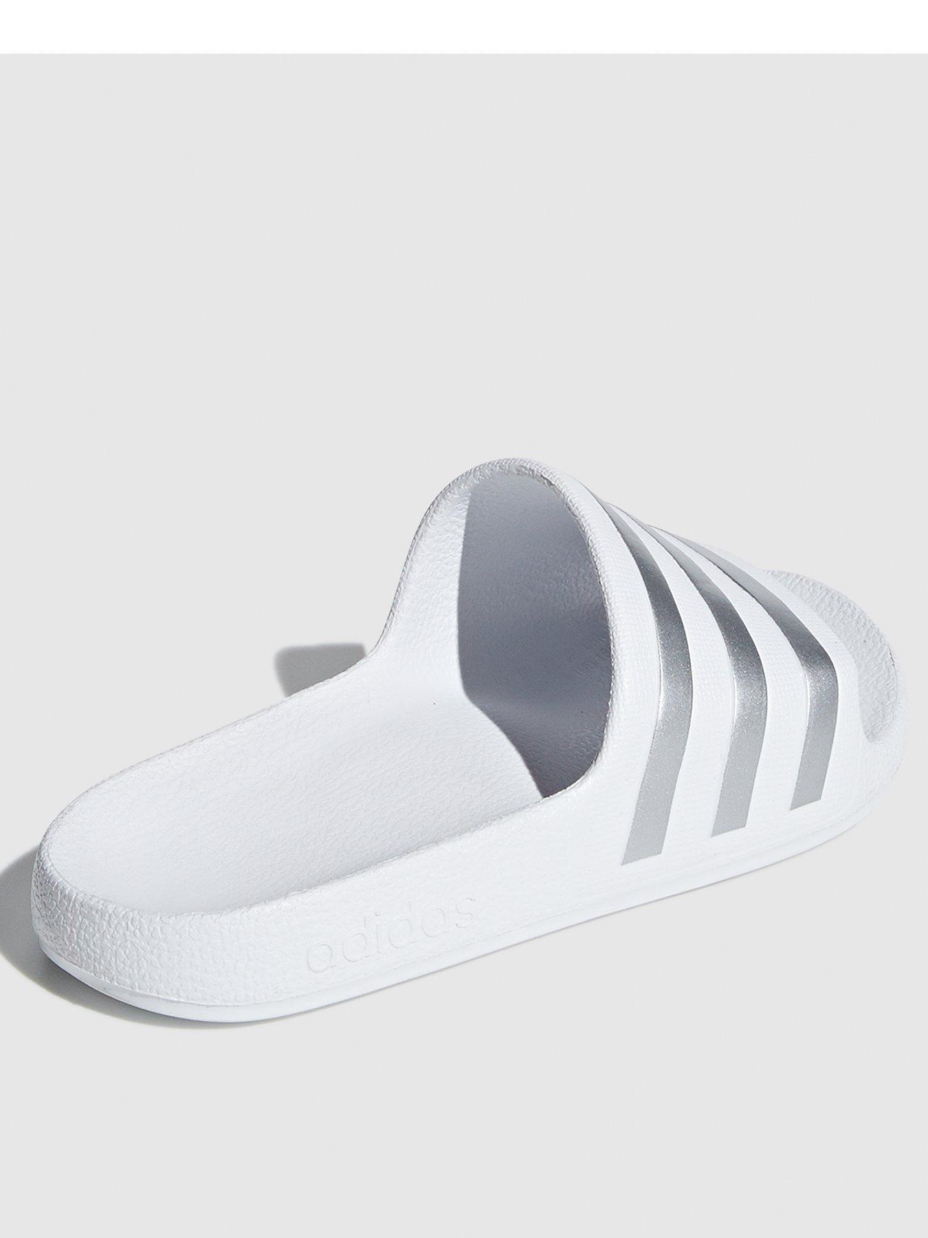 white and silver adidas sliders