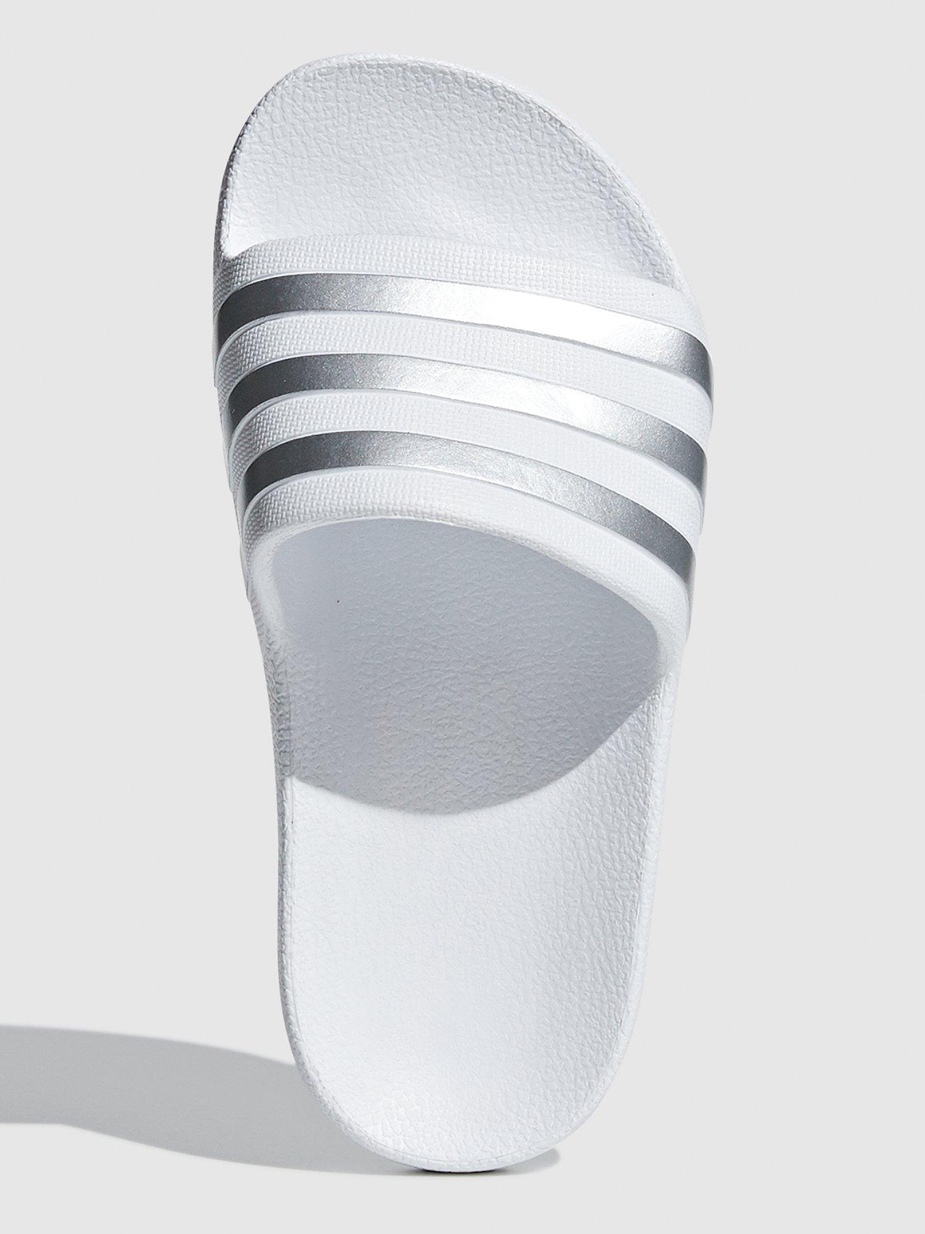 white and silver adidas sliders