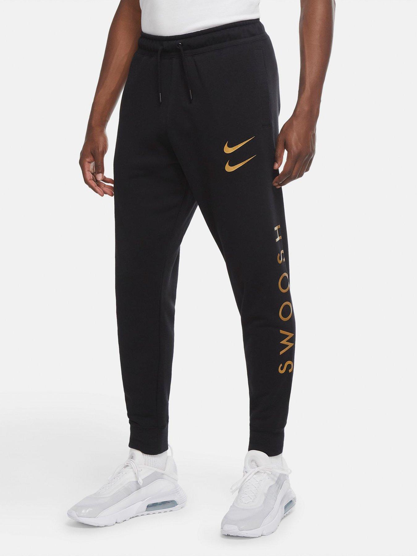 nike swoosh cuffed joggers in black