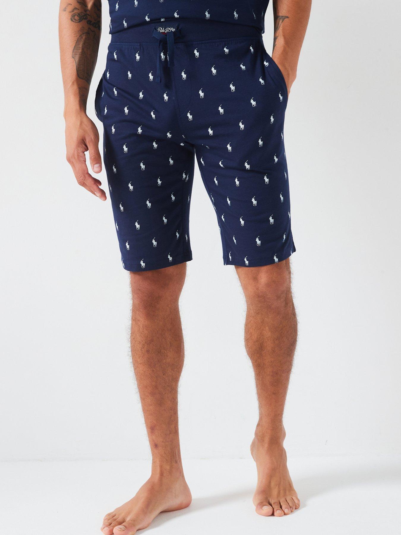 Polo shorts with on sale logo all over