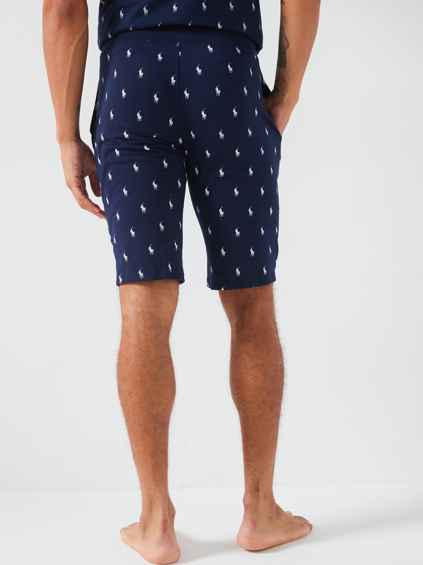 Polo shorts with logo best sale all over