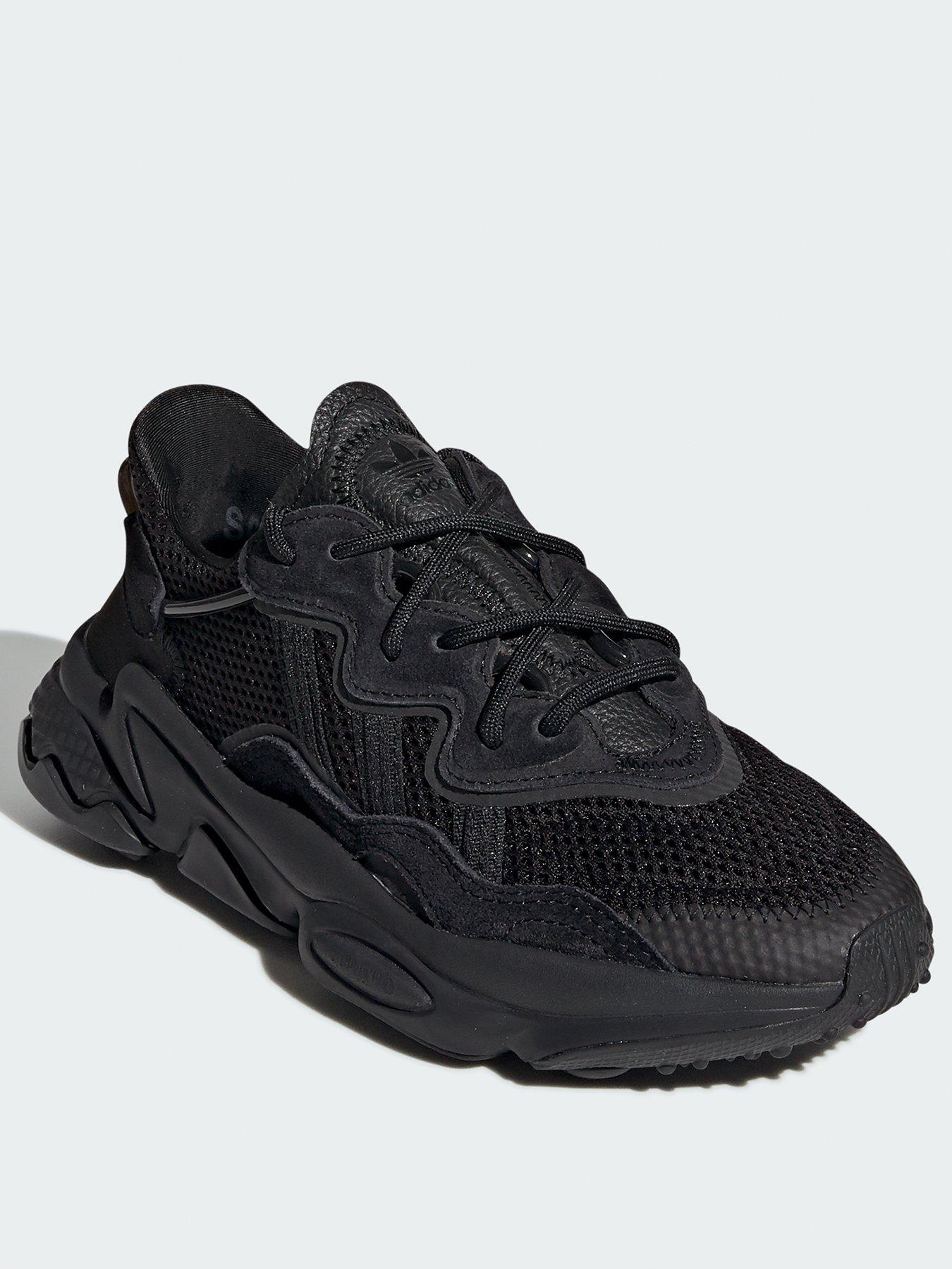 All black junior store trainers