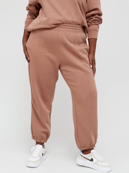 front image of nike-nsw-trend-pants-curve-brown