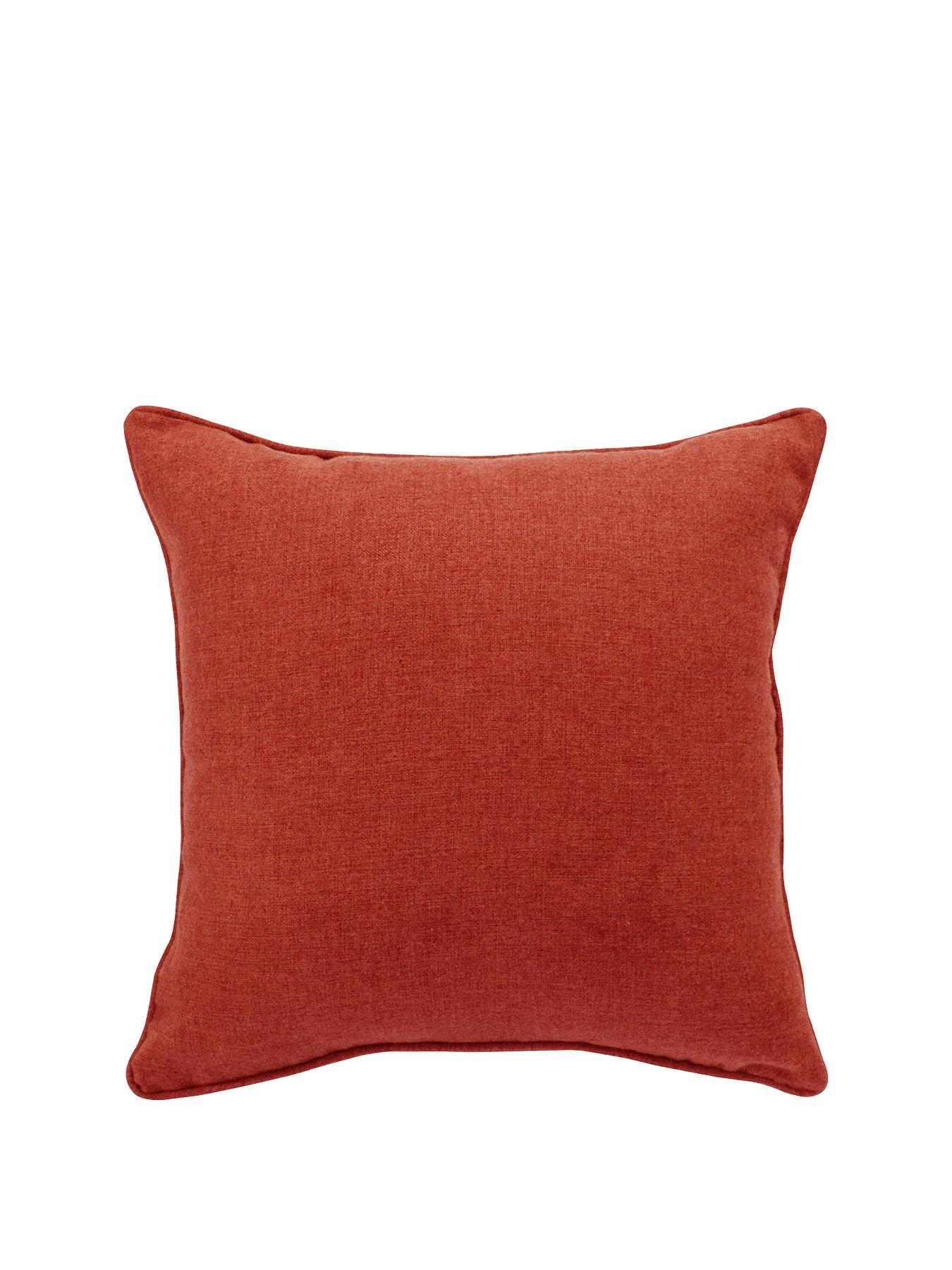 orange cushions and throws