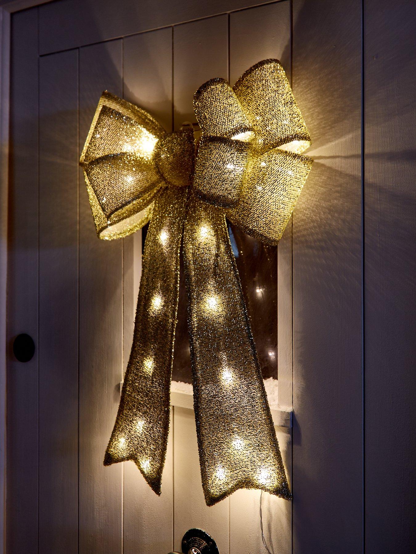 Product photograph of Gold Lit Door Bow Christmas Decoration from very.co.uk