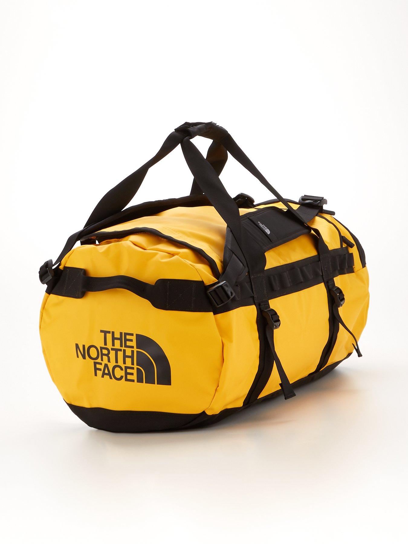 North face duffel 2025 bag medium yellow