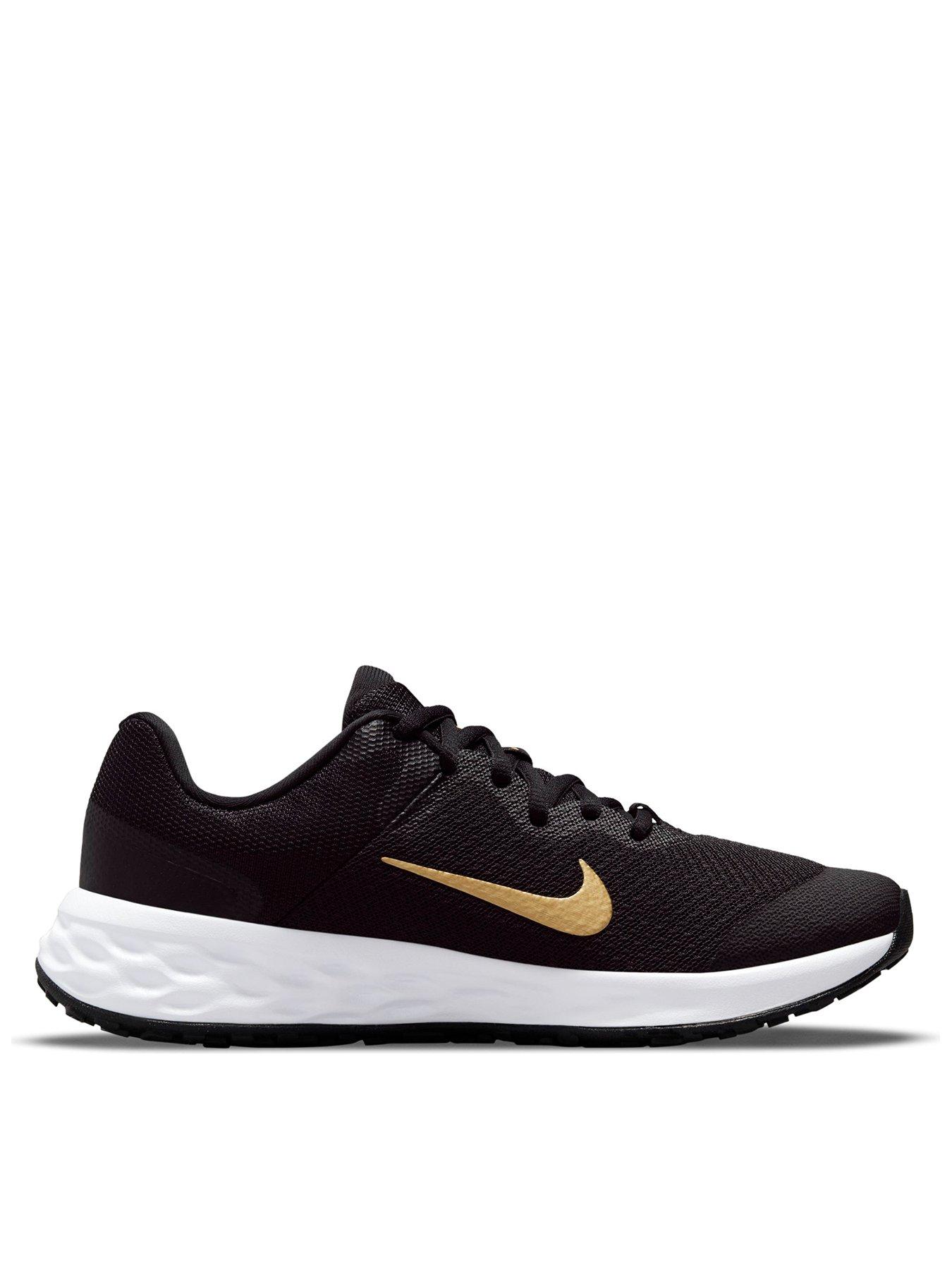 Gold and black hot sale nike trainers