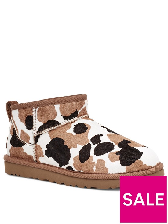 front image of ugg-classic-ultra-mini-cow-print-ankle-boots