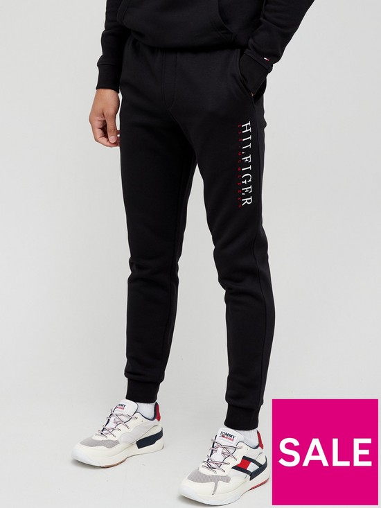 front image of tommy-hilfiger-corp-graphic-logo-joggers-black