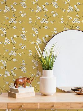 Product photograph of Fresco Apple Blossom Ochre Wallpaper from very.co.uk