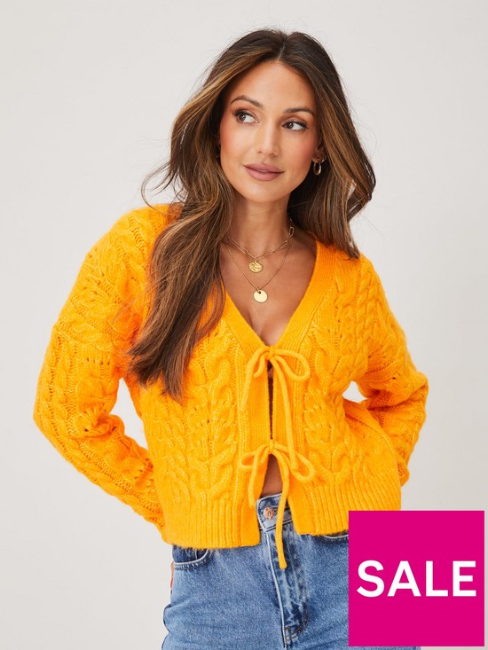 front image of michelle-keegan-tie-front-cable-cardigan-orange
