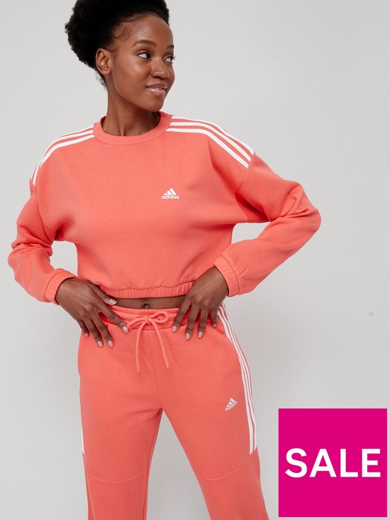 front image of adidas-glam-babe-crop-crew-sweat-top-coral