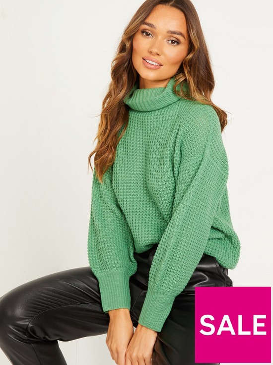 front image of quiz-waffle-knit-jumper-green