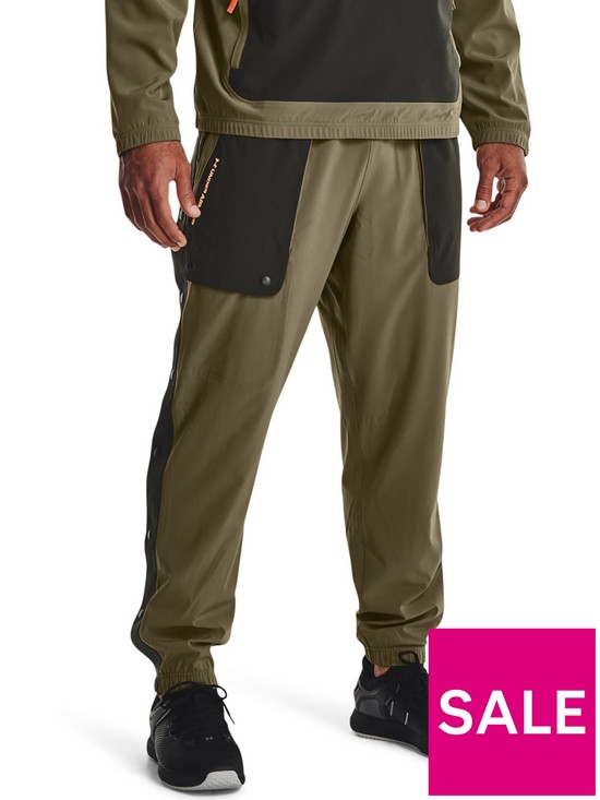 front image of under-armour-training-rush-woven-tear-away-pants-khaki