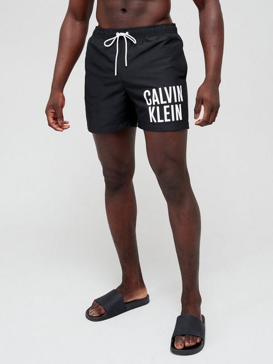 front image of calvin-klein-medium-drawstring-swim-shorts-black