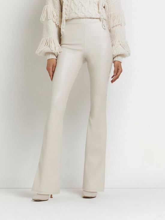 front image of river-island-matte-coated-flare-trouser-cream