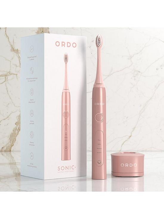 back image of ordo-sonic-electric-toothbrush-rose-gold--nbsp4-brush-modesnbspclean-white-massage-amp-sensitive